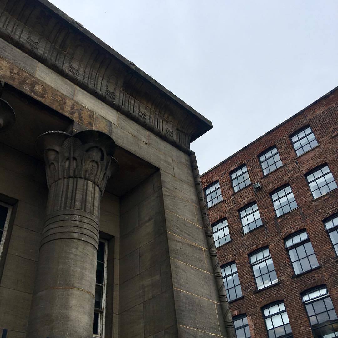 outside of marshall's mill building looking towards the sky