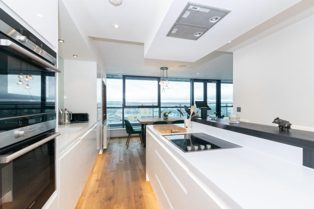 kitchen in apartment showing views of the city