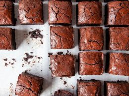 rows upon rows of brownies, some with crumbles or bits missing