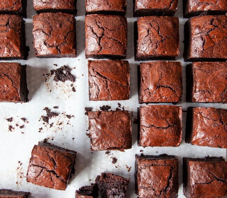 rows upon rows of brownies, some with crumbles or bits missing