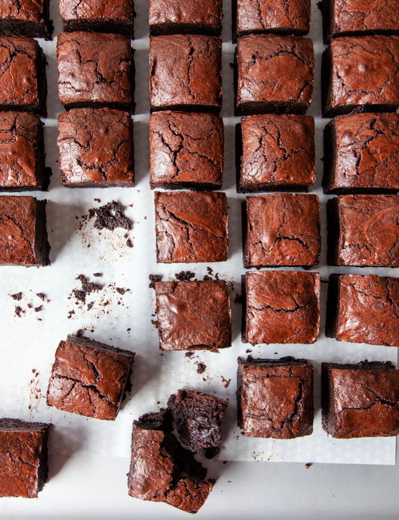 rows upon rows of brownies, some with crumbles or bits missing