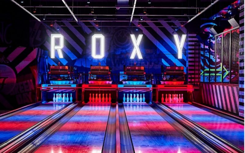 bowling alley with R O X Y letters spaced out above the wall