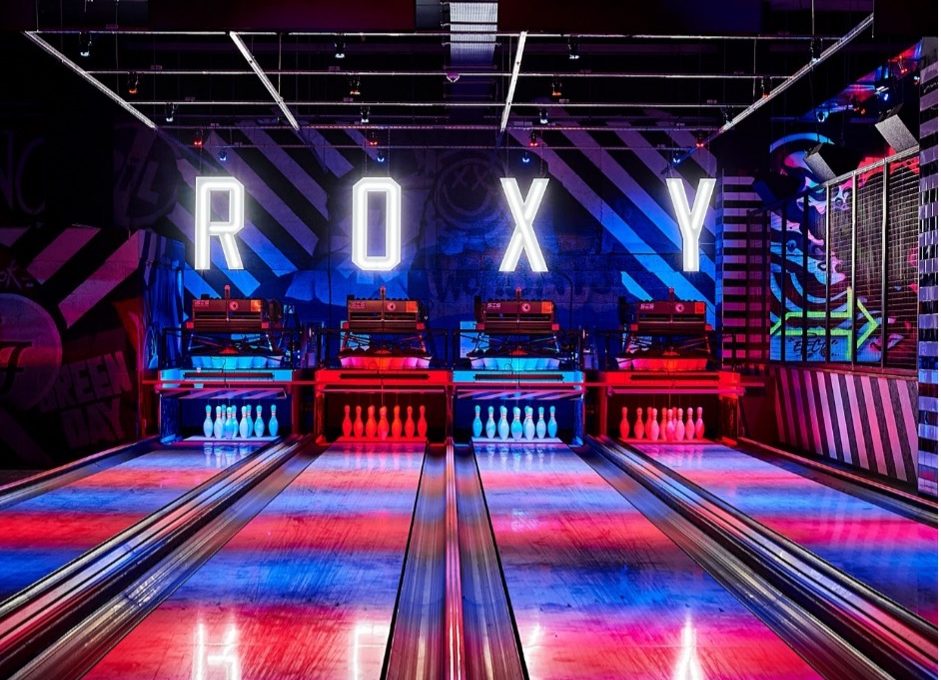 bowling alley with R O X Y letters spaced out above the wall