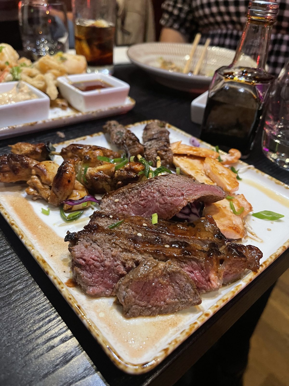 Sakku meat dish with skewers, duck and beef.