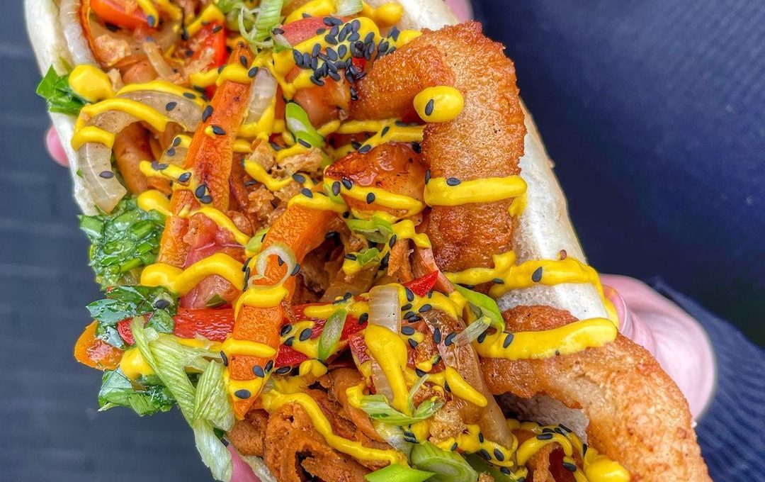 doner summer philly cheesesteak with sauce drizzled over