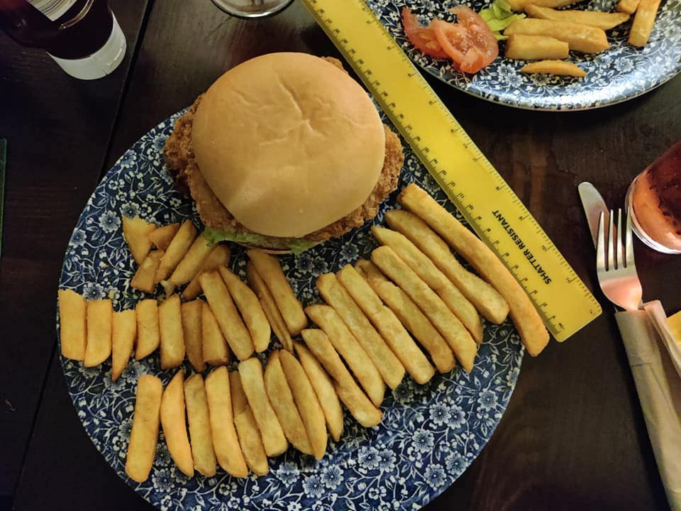 Plate of 29 chips at Wetherspoons with a measuring tape