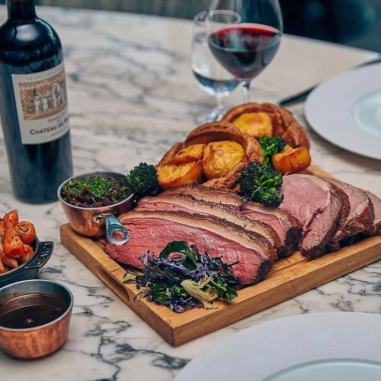 steak cut into pieces with roast potatoes.