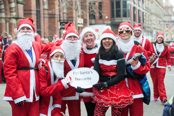lots of people dressed as santa in leeds city centre