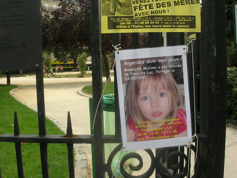 poster in France of missing child Madeleine McCann on a gate.