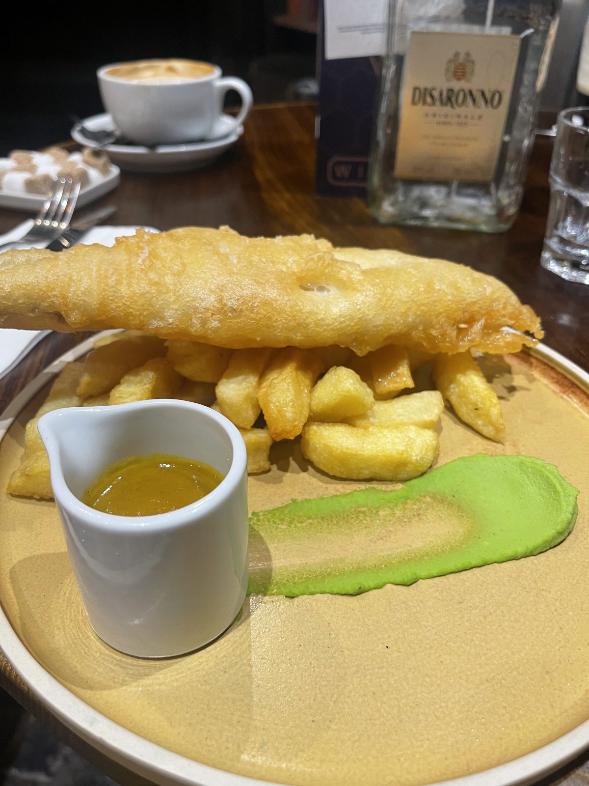 fish and chips on a plate.