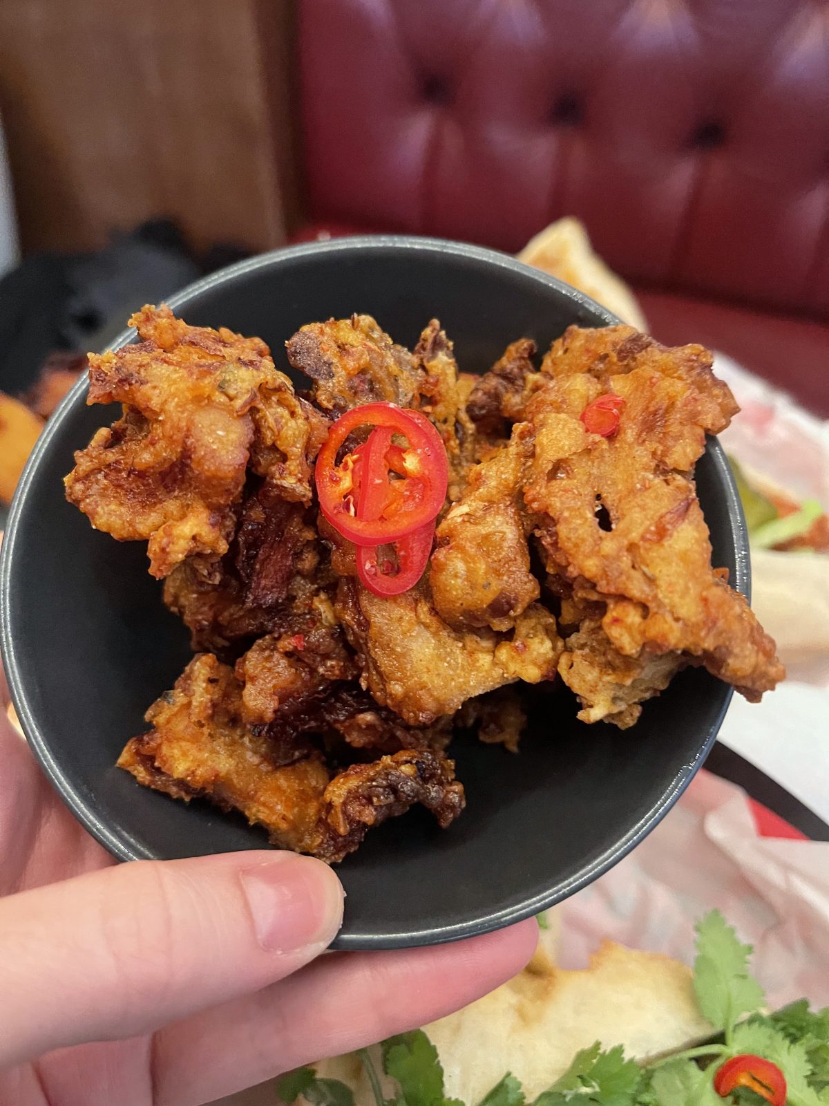Korean Style fried oyster mushrooms with a chilli on top.