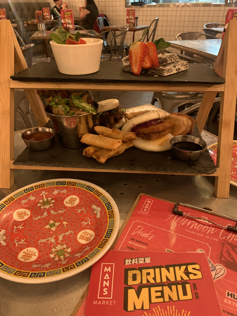 plates stacked on an afternoon tea tray.