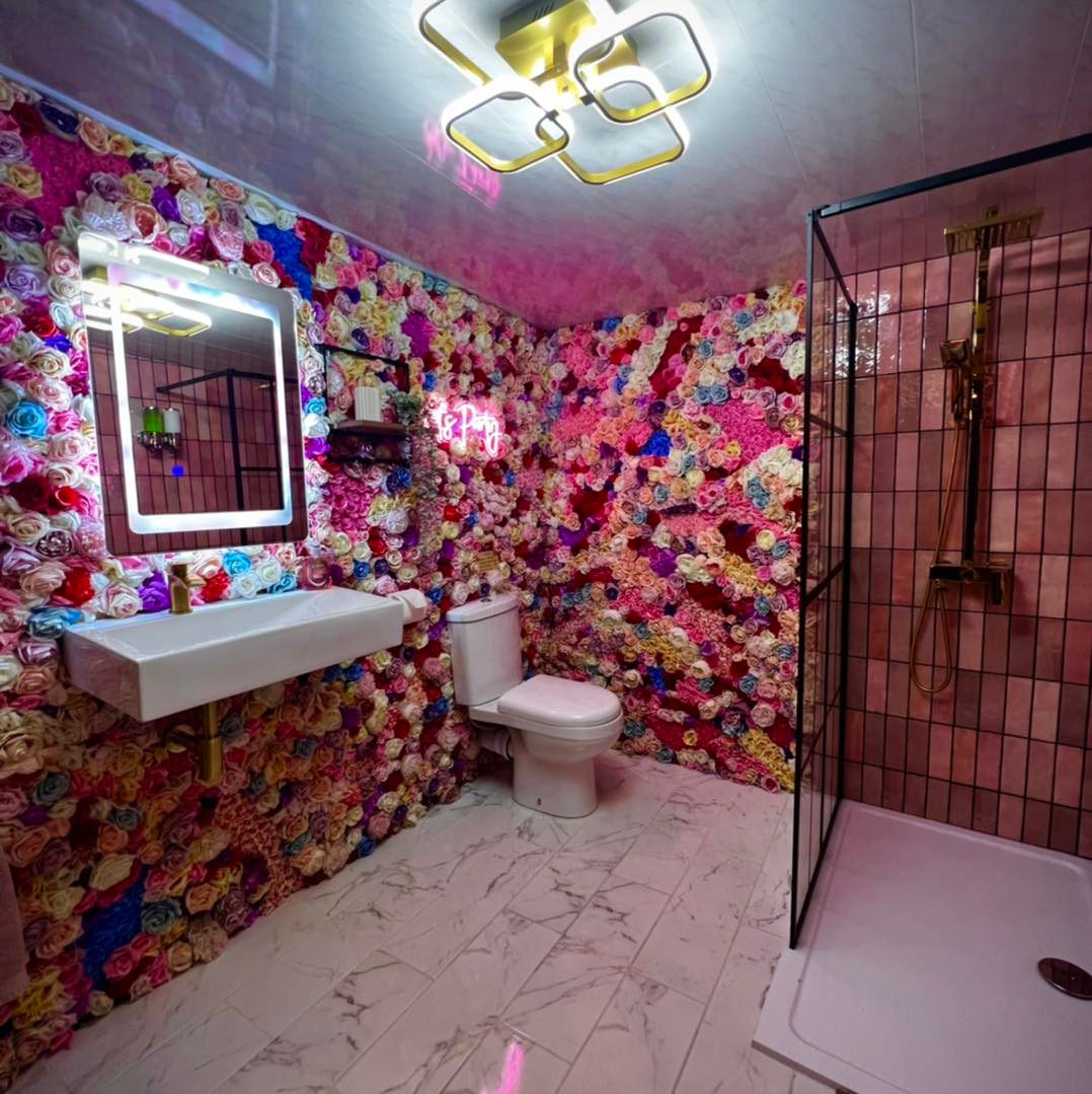 bathroom with flower wall.