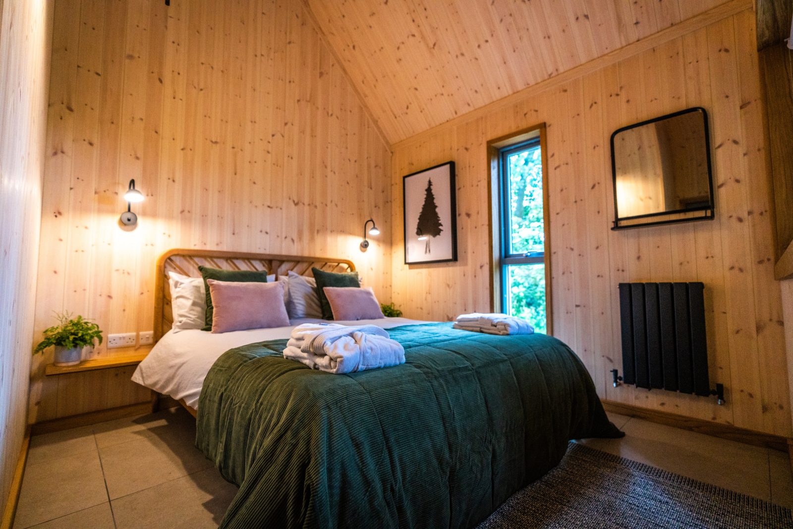 The bedroom inside of the Lark cabin.