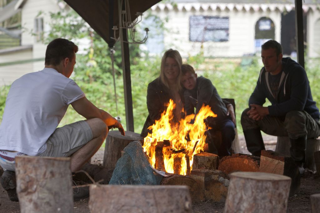 A family sat round a fire pit at The North Star Club.