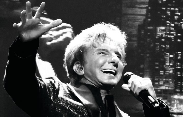 Barry Manilow performing on stage. 