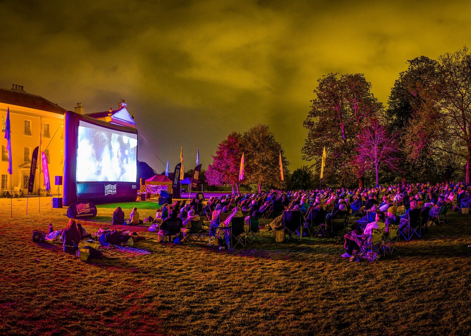 Open-air cinema event in the night time. 