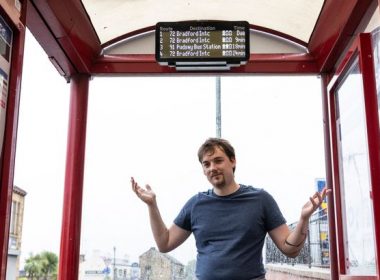 A man at a bus stop.