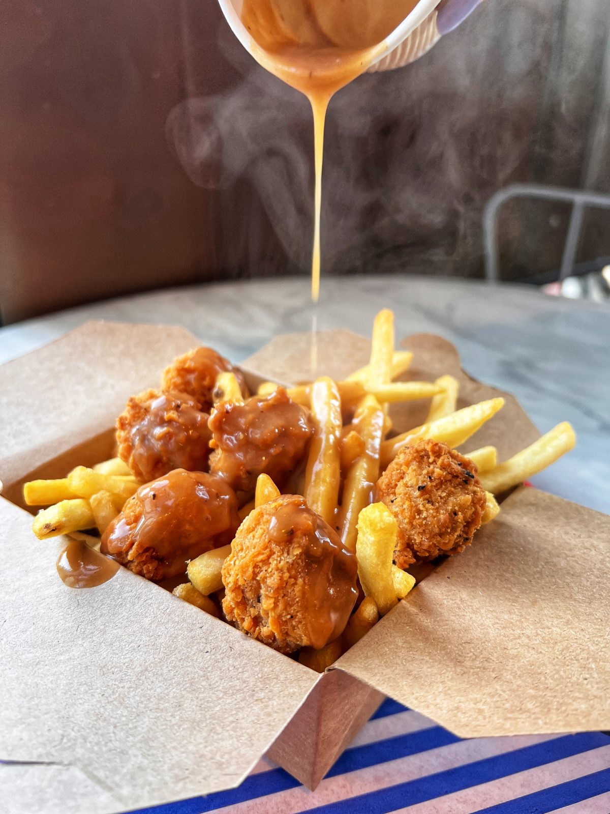 Vegan chicken and chips with gravy.