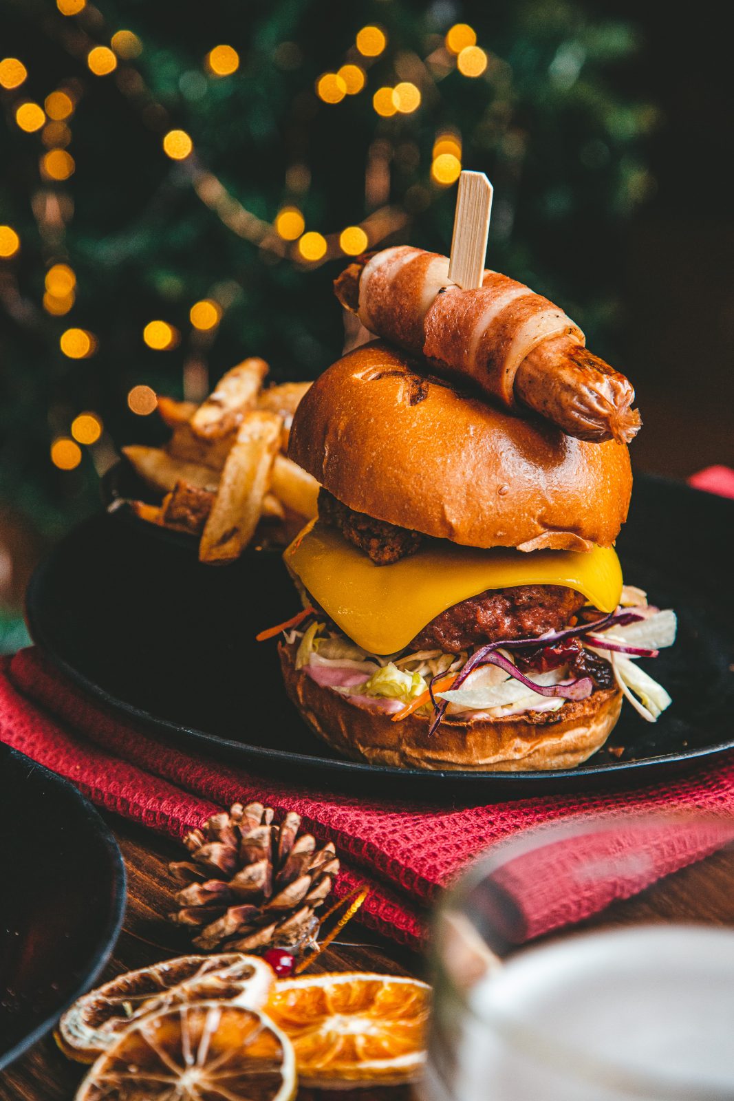 Christmas burger with a pig in blanket on top.
