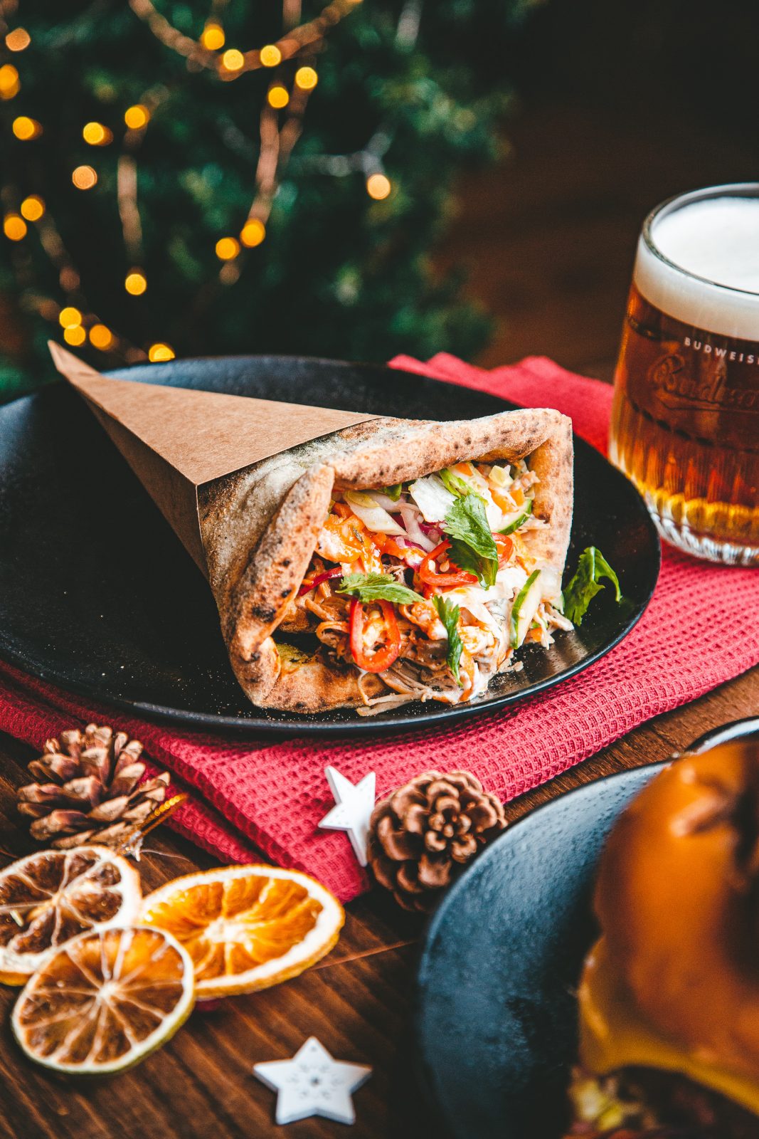 Christmas kebab next to a beer.