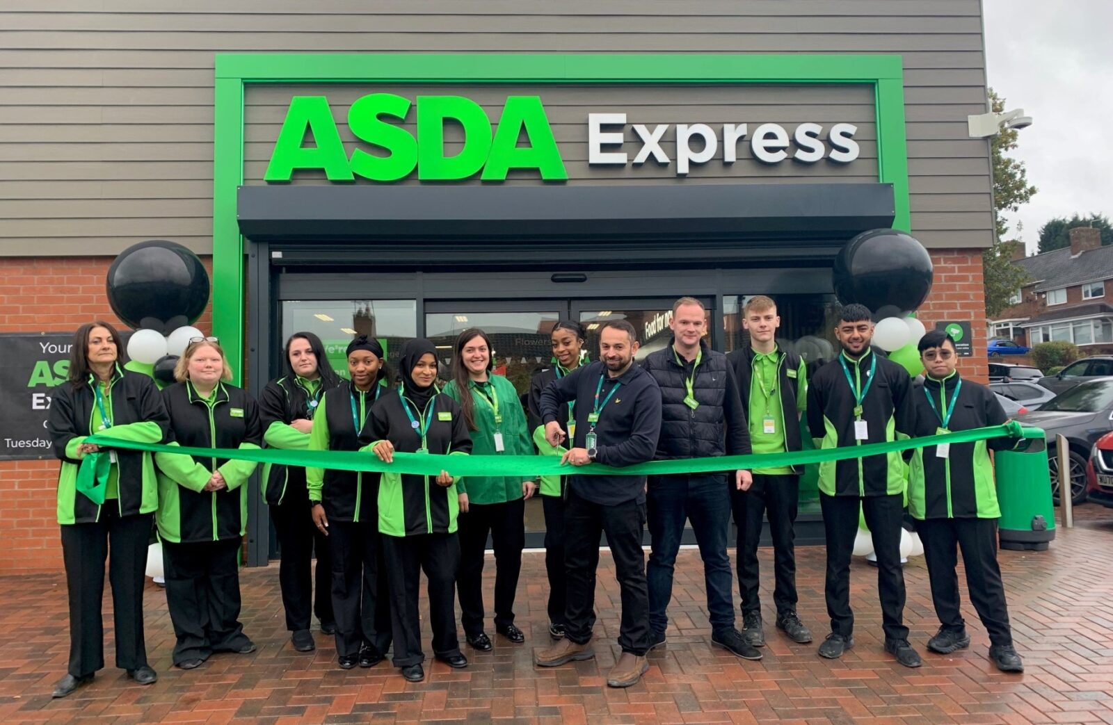 The opening of an Asda express shop.