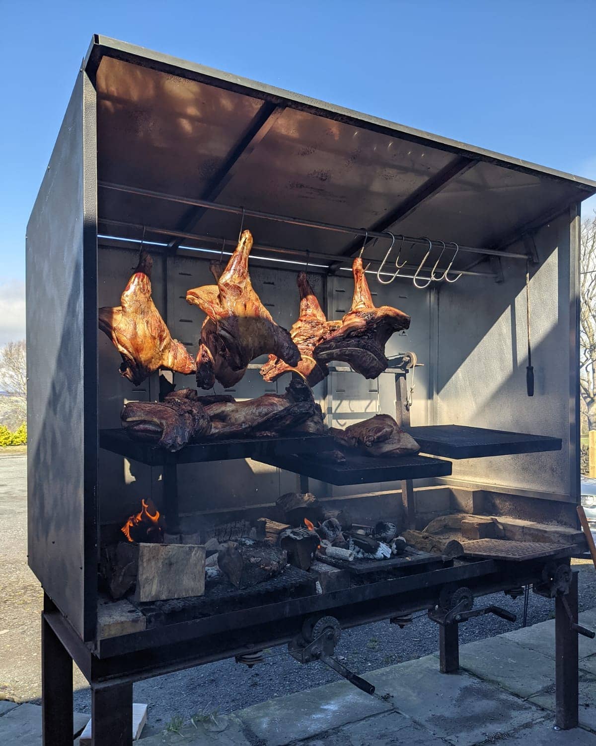 Food cooking on an outdoor barbecue at The Moorcock Inn. 