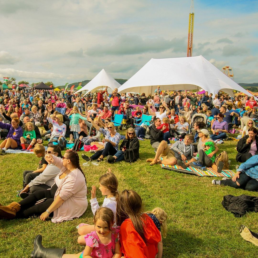 people sat on grass.