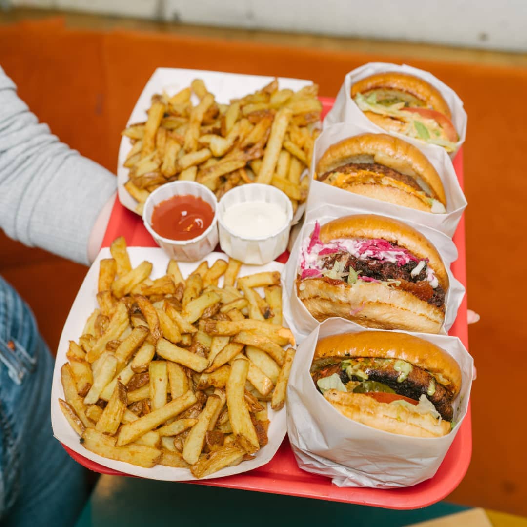 burers and fries on a tray.