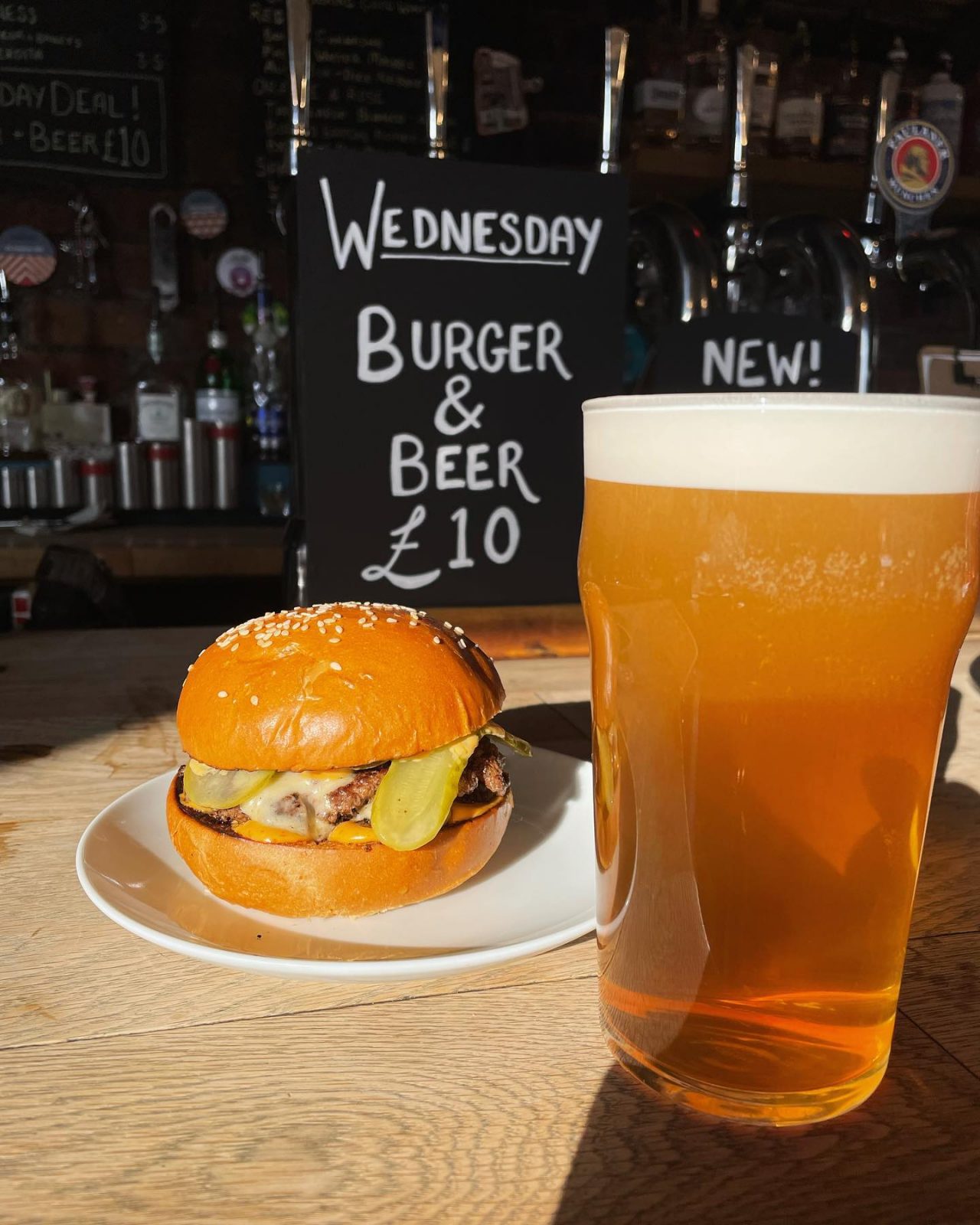 beer and burger on a bar.