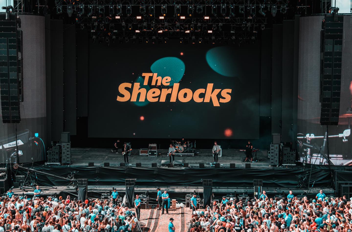 The Sherlocks performing at a festival. 