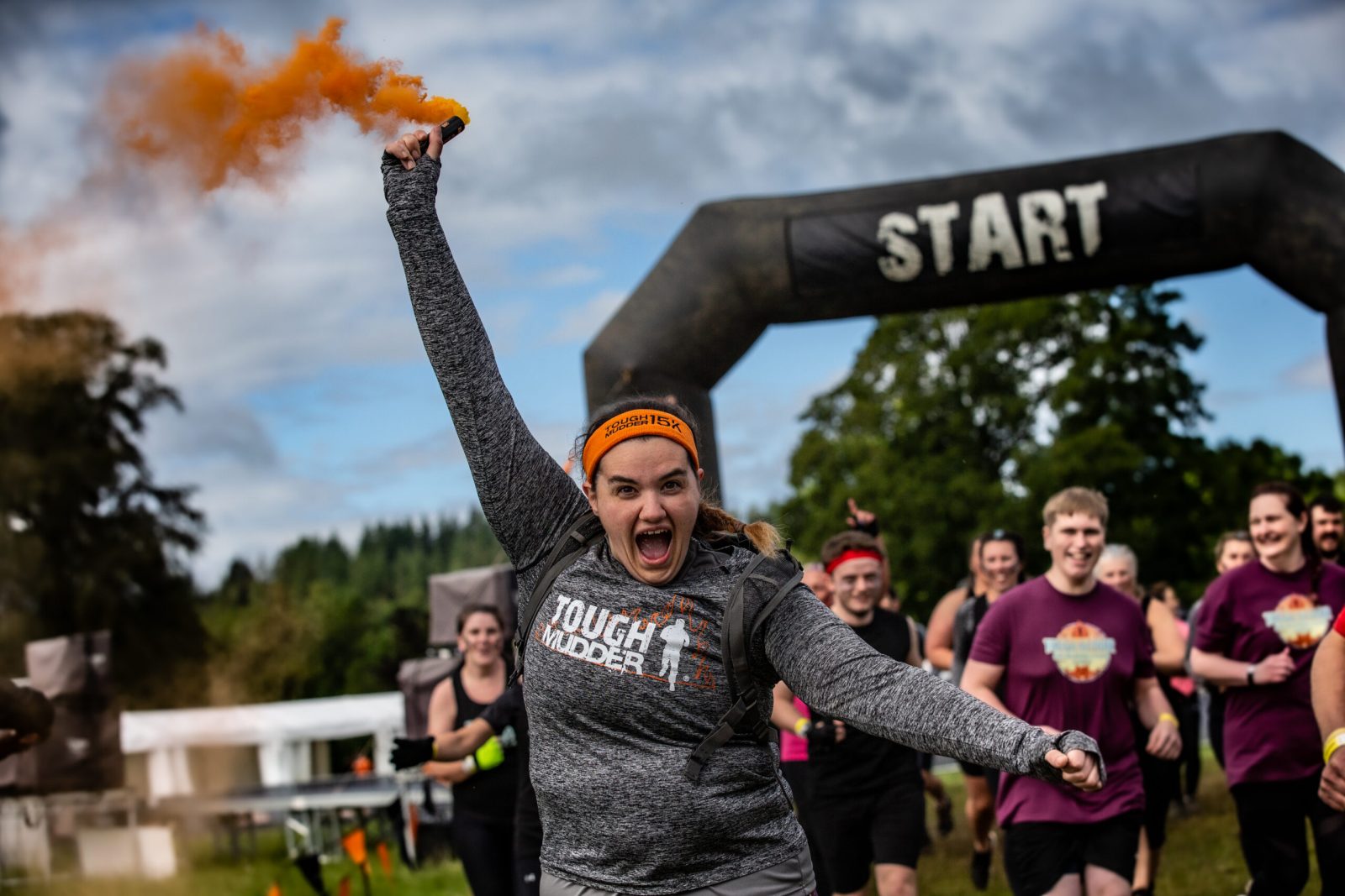 person with flare at end of run.