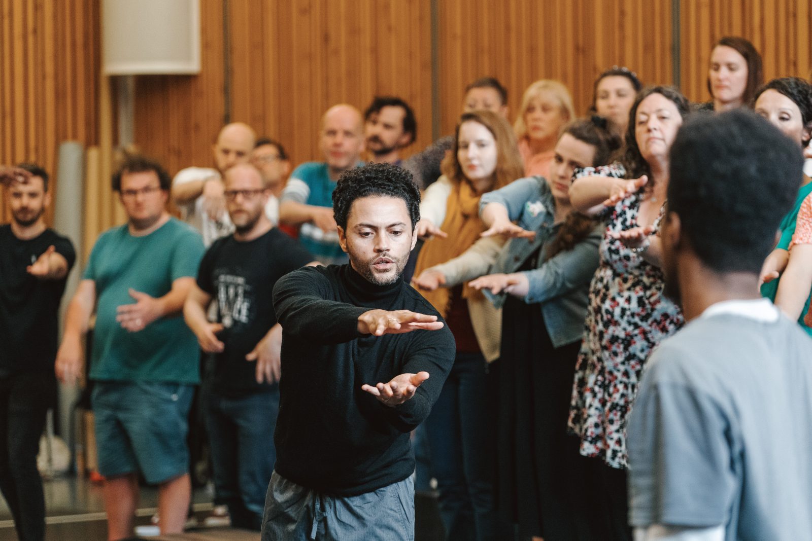 Choreographer Dane Hurst works with the Chorus of Opera North in rehearsal for Requiem.
