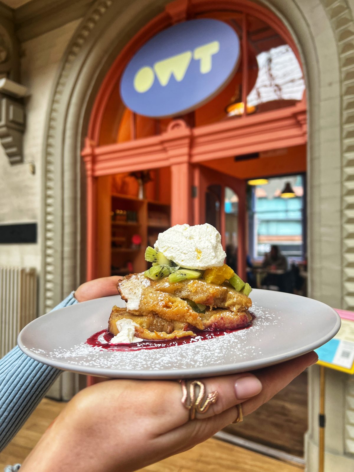 Stacked French toast with kiwi and mango.