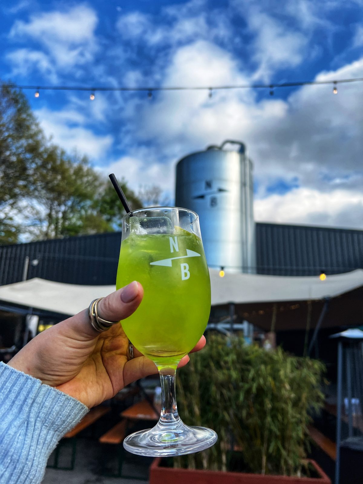 Glass with green cocktail.