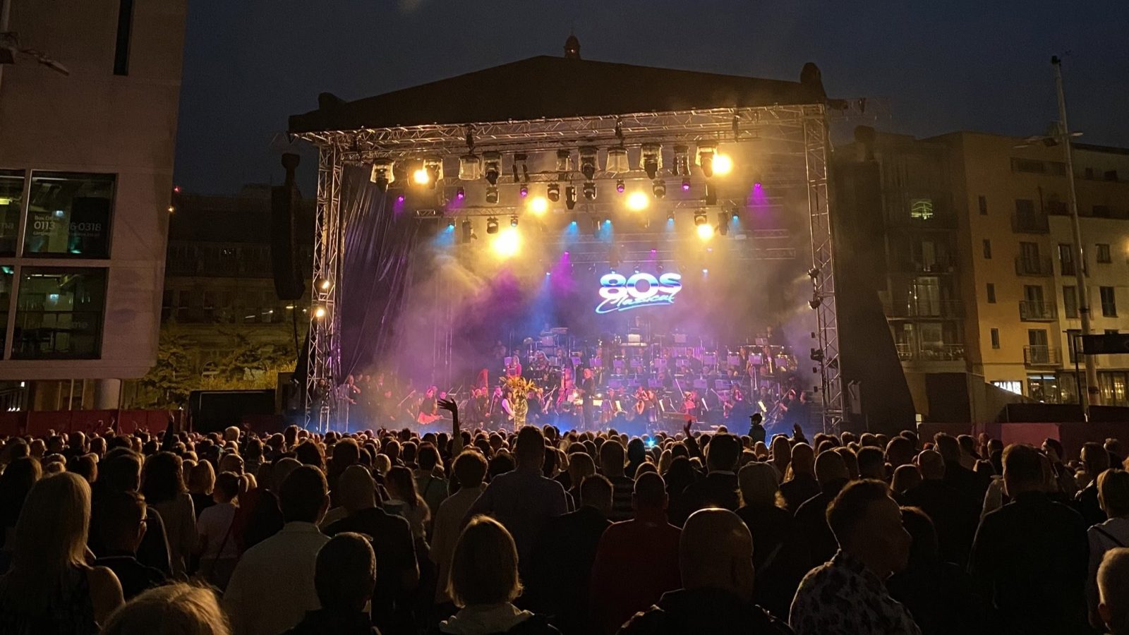 stage with crowd outside.