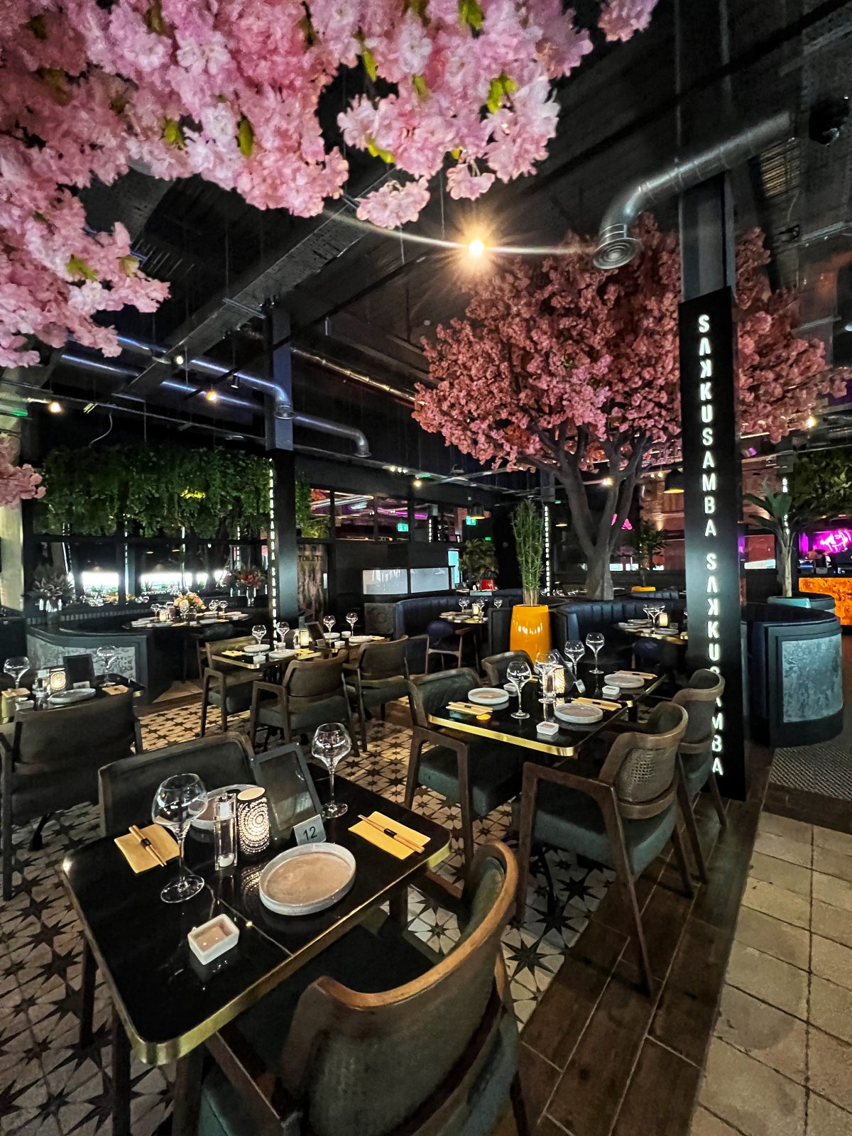 venue with pink tree in foreground.