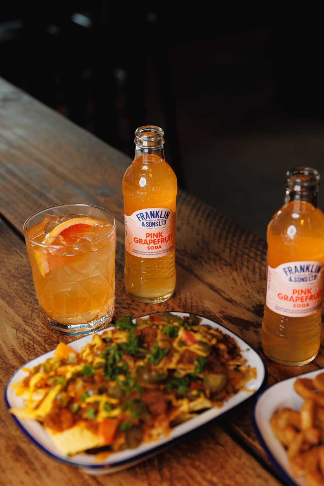 pink grapefruit soda and loaded fries.