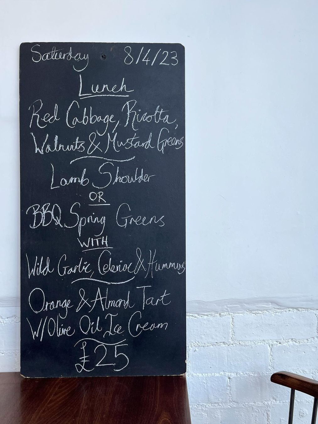 A menu chalkboard with Saturday lunch menu written on it.