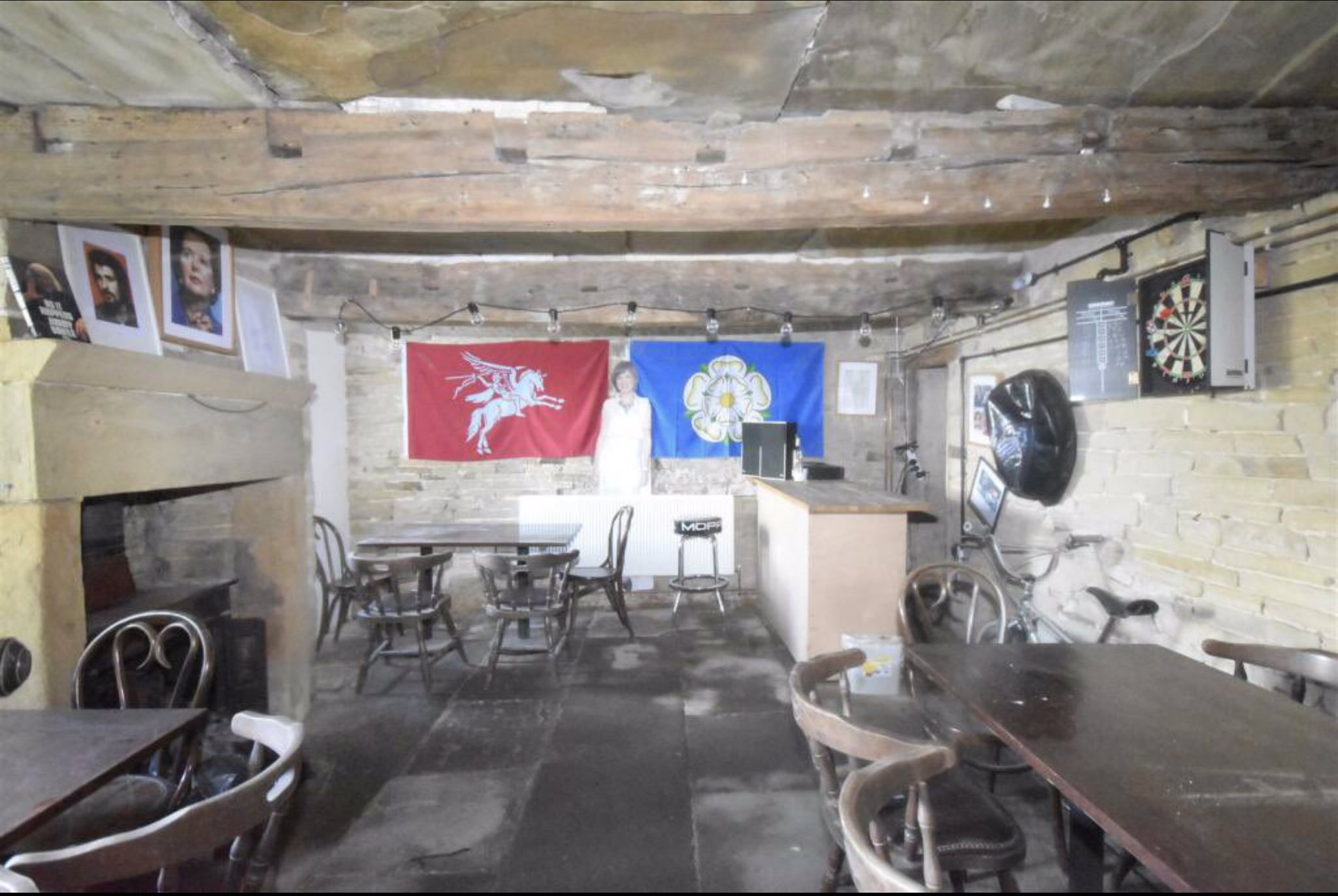 This Yorkshire cottage has a basement bar with shrine to VERY unlikely celebrities