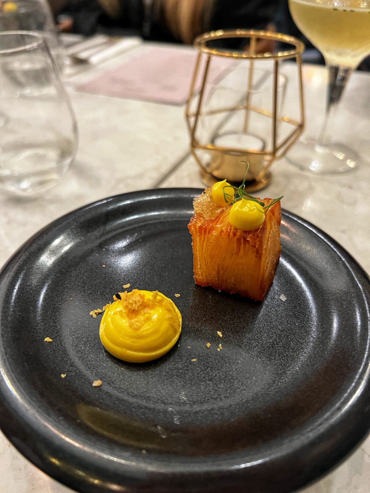 potato terrine with mustard on a blue plate.