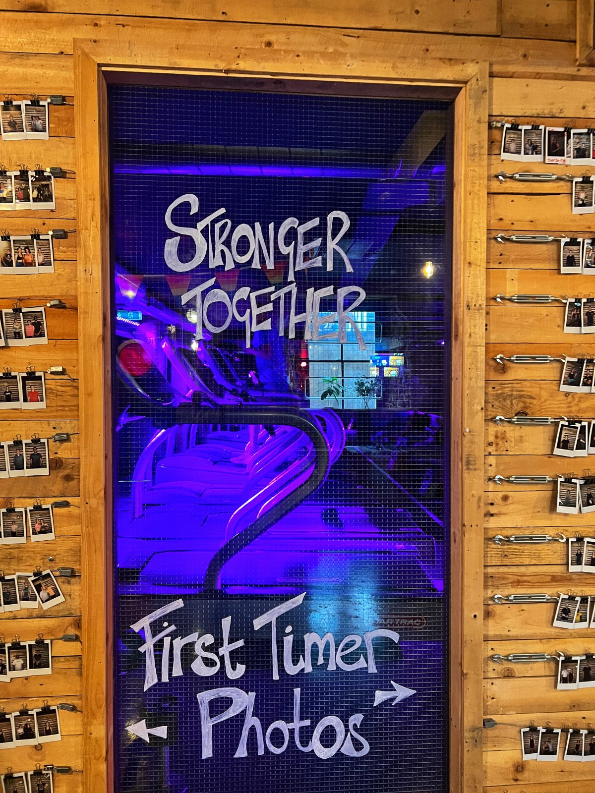 sign that says 'stronger together' and 'first time photos'.