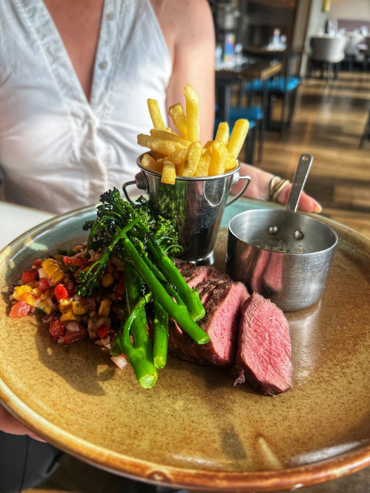 Steak, chips and broccoli. 