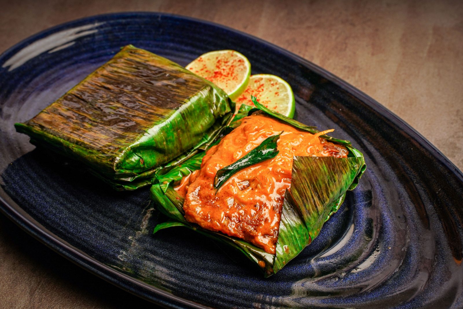 A fillet of sea bass in a banana leaf.