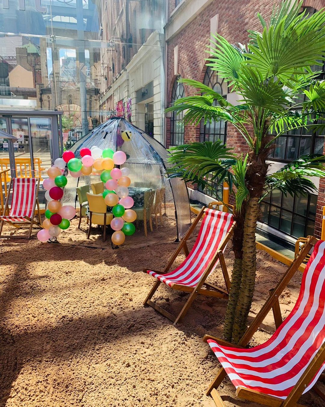 Two deck chairs on a big sandpit within the Light in Leeds. 