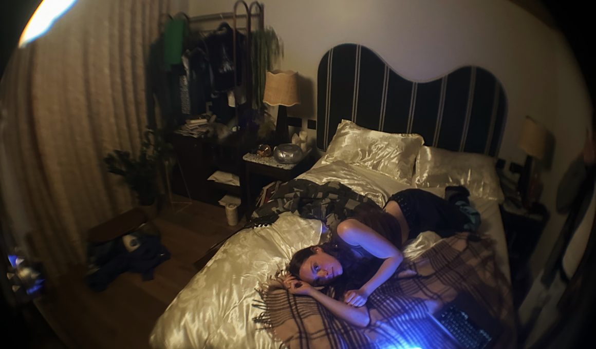 Person in a bedroom painted black.