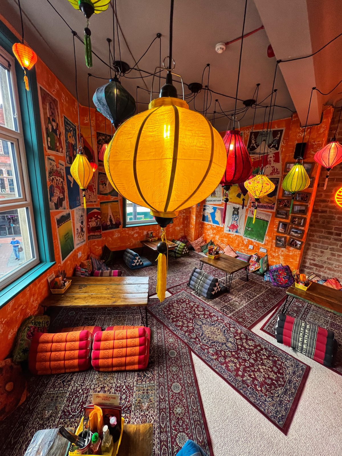 cushioned eating area with a yellow lantern.