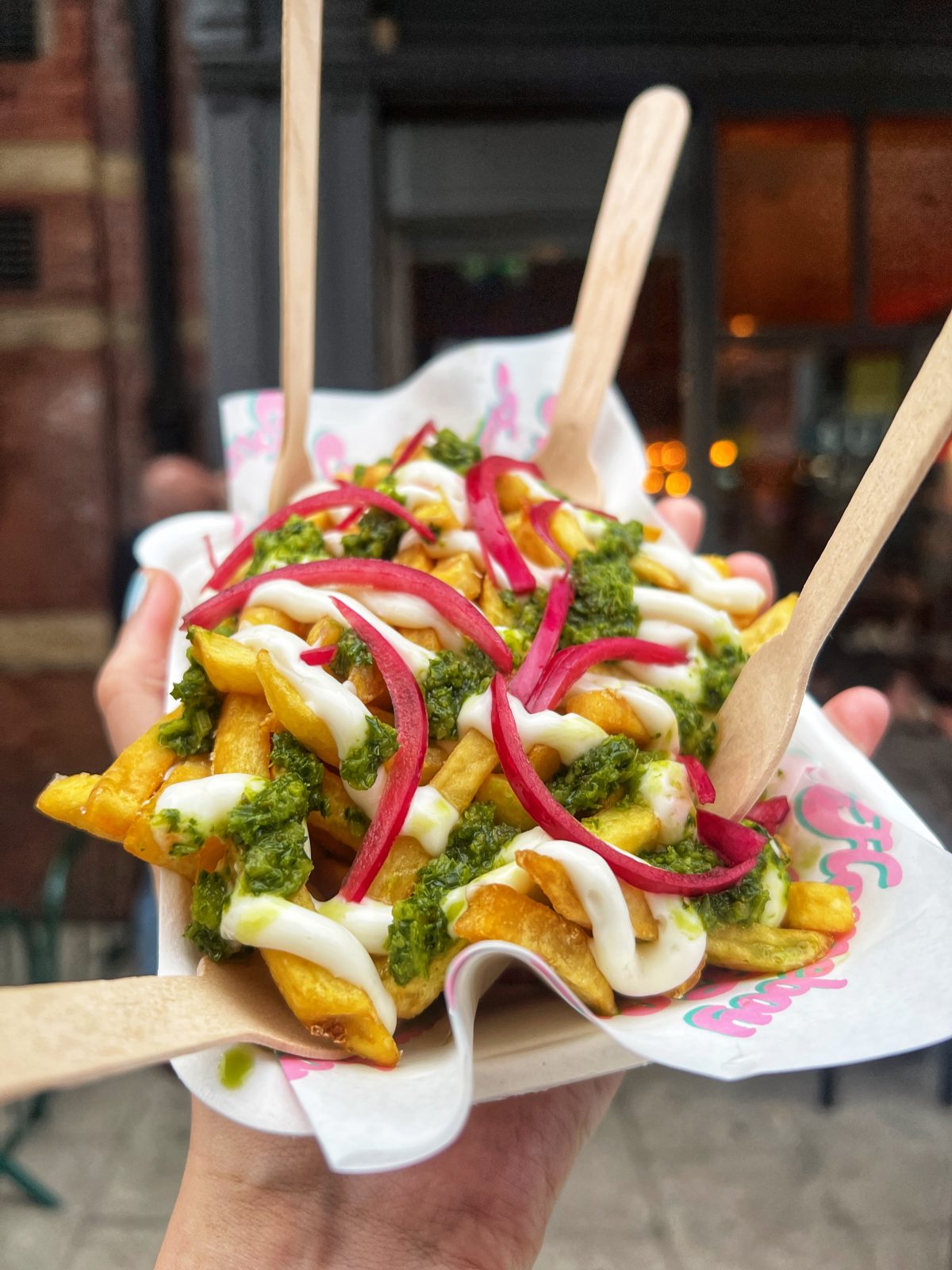 Loaded fries with pickled pink onions. 