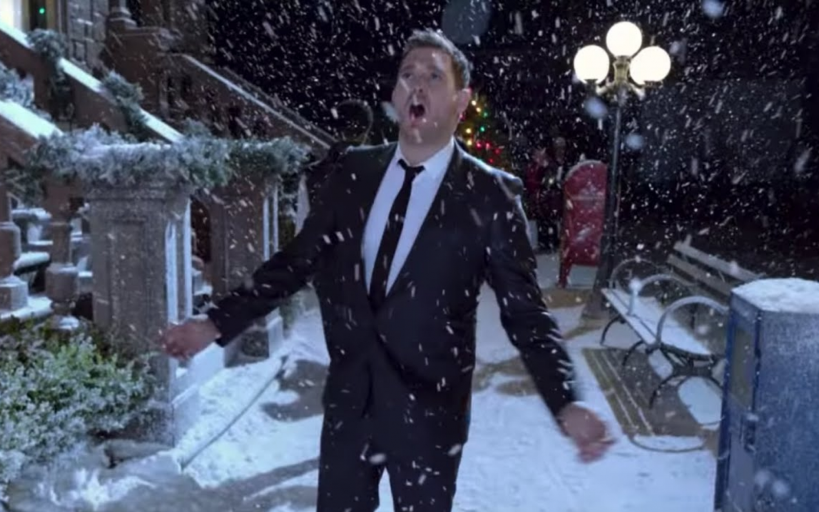 A still image from a Christmas song music video. 