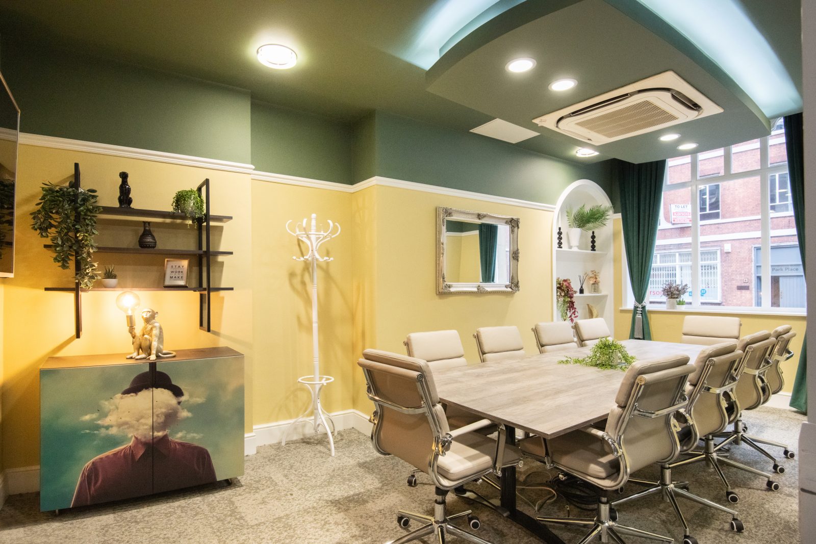 A meeting room with yellow wallpaper. 